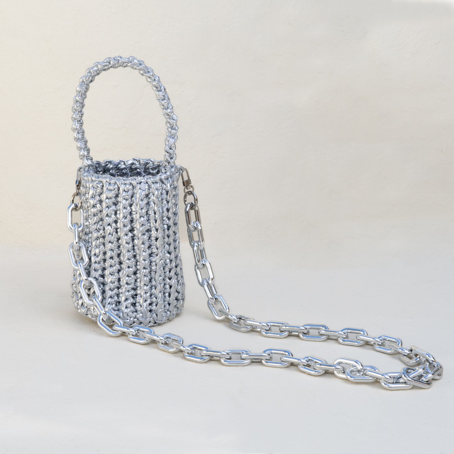 
                  
                    Roundy Mini Bucket Bag in Metallic Silver
                  
                