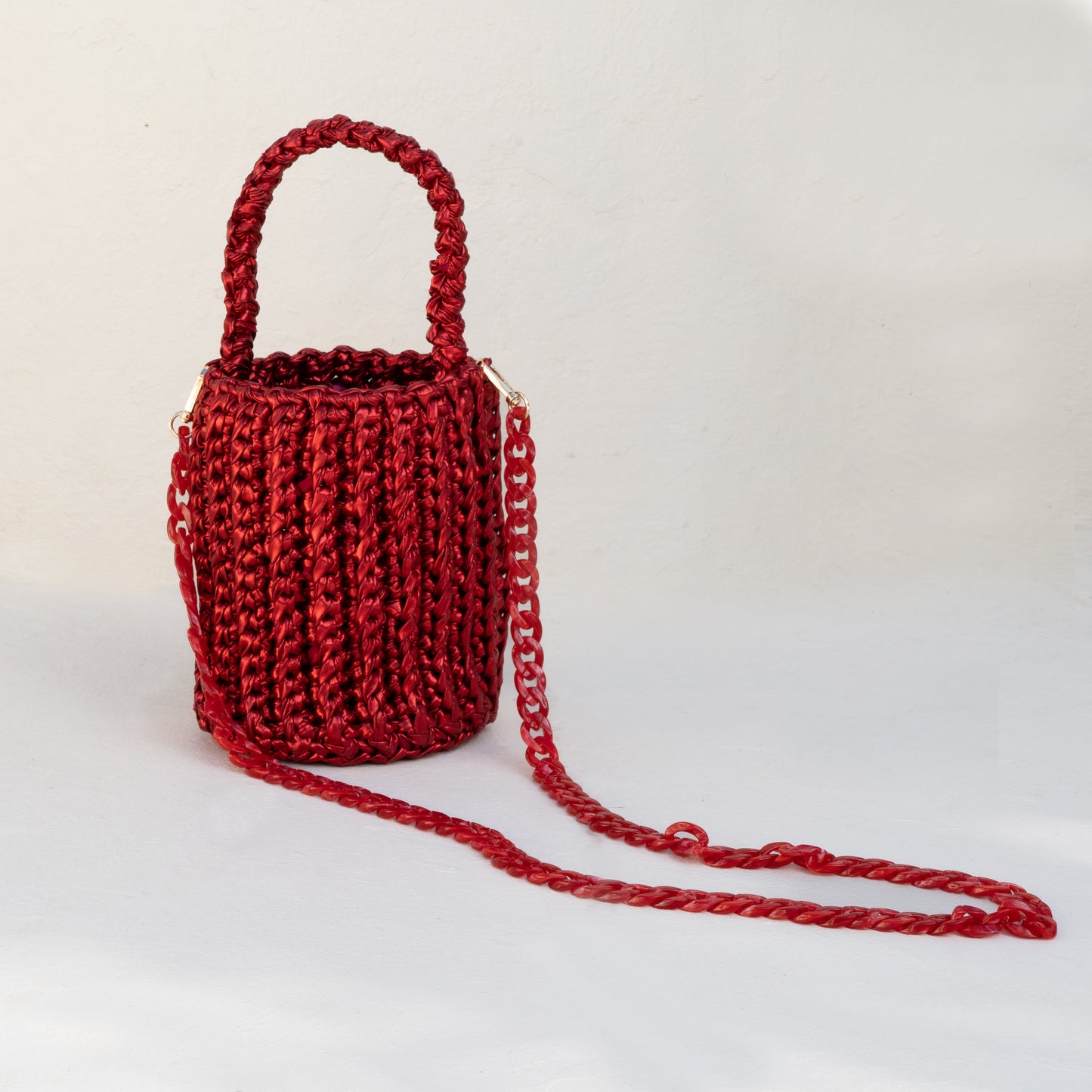 
                  
                    Roundy Mini Bucket Bag in Metallic in Red
                  
                