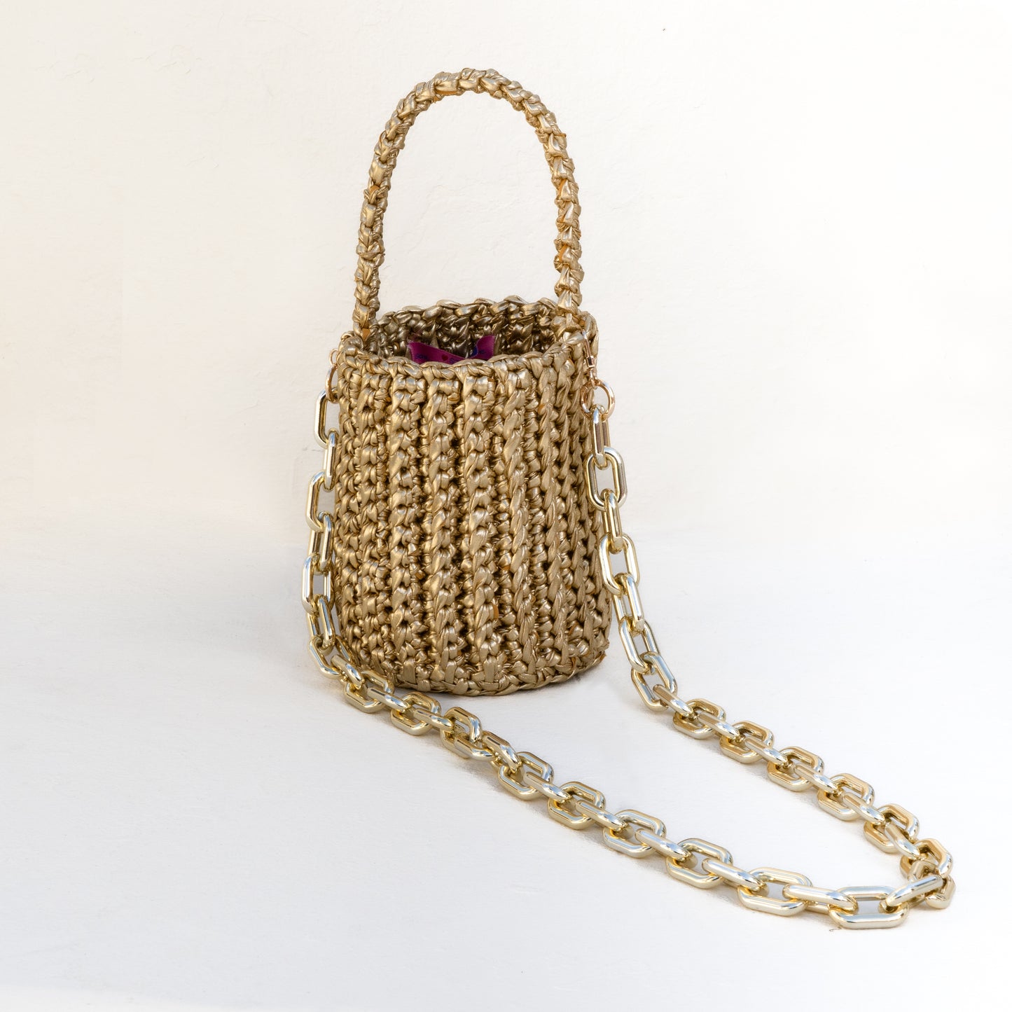 
                  
                    Roundy Mini Bucket Bag in Metallic in Gold
                  
                