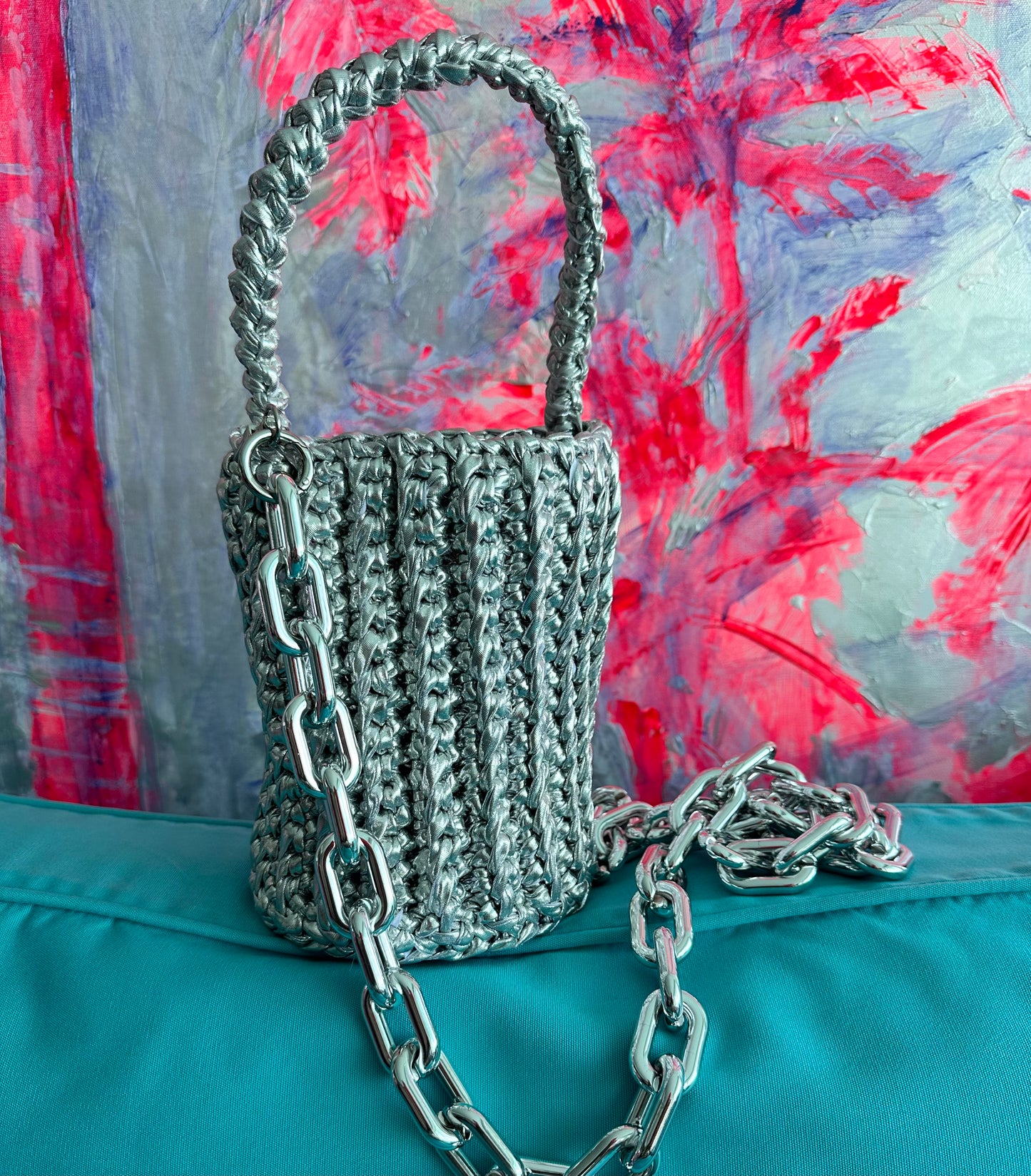 
                  
                    Roundy Mini Bucket Bag in Metallic Silver
                  
                