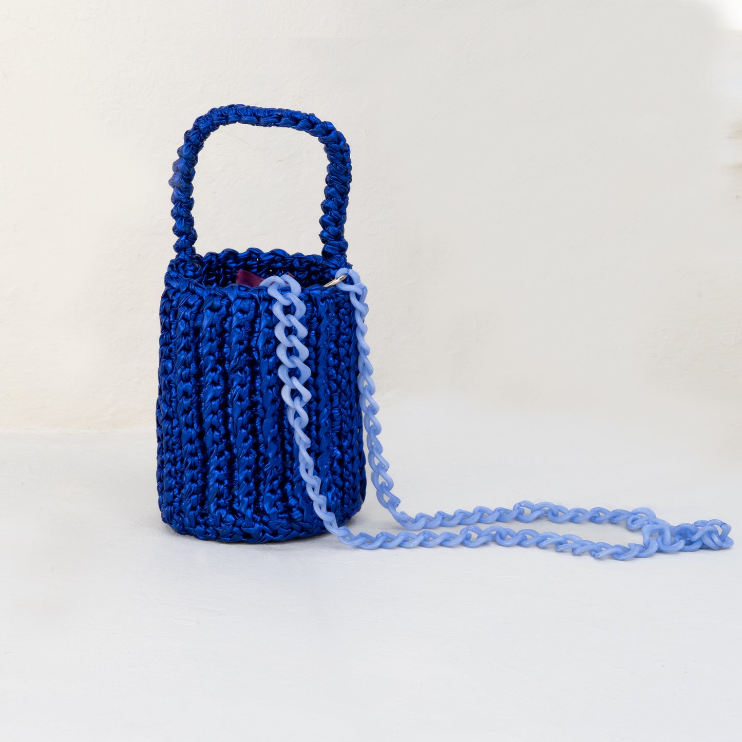 
                  
                    Roundy Mini Bucket Bag in Metallic Blue
                  
                